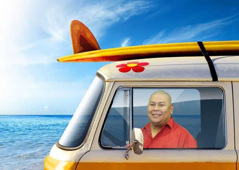 A participant "drives" a VW Van on the beach in this Miami Green Screen Photo Booth