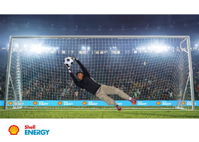 A participant saves the GOAL at this Boston green screen photo booth for Shell Energy